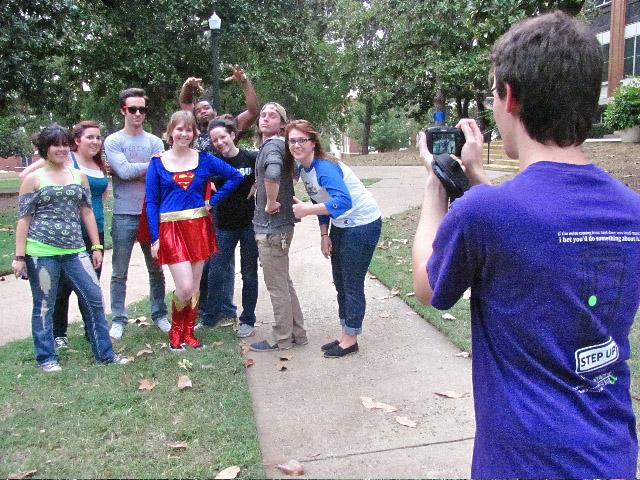 Members of Alpha Psi Omega are photographed by team member Taylor Donaldson with Supergirl, student senator and sophomore English major Sadie Woodruff. EAch team participating in A Day in the Life of Peter Parker was given a list of clues to 10 different locations on campus where the groups had to photograph themselves in order to complete the scavenger hunt event.