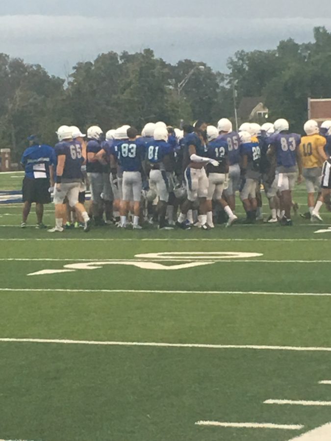 The+Southeastern+football+team+huddles+up+at+the+scrimmage+on+August+18.
