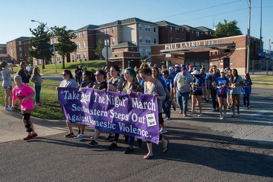 Faculty, staff and students begin their march for domestic violence awareness.