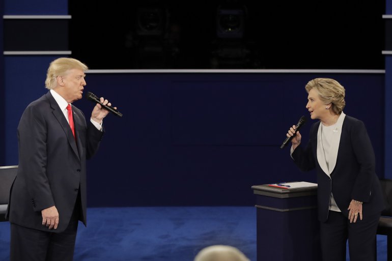 Trump and Clinton ferociously participating in the presidential debate held at Washington University in St. Louis on Oct. 9, 2016. (AP Photo/Julio Cortez)