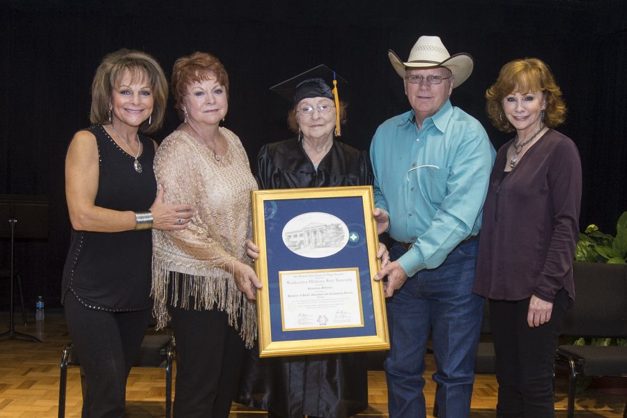Mrs. Jacqueline McEntire, center, holds the honorary degree she received from Southeastern Thursday. Joining her are her children, Susie McEntire-Eaton, Alice Foran, Pake McEntire, and Reba McEntire.