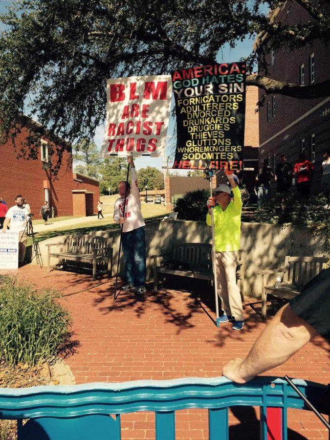 Protestors firmly stated their judgements of people, specifically Southeastern students while making racist remarks and moral accusations across from Southeasterns Fine Arts building.