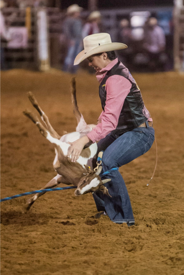 Kylee Bennett competes in goat tying.