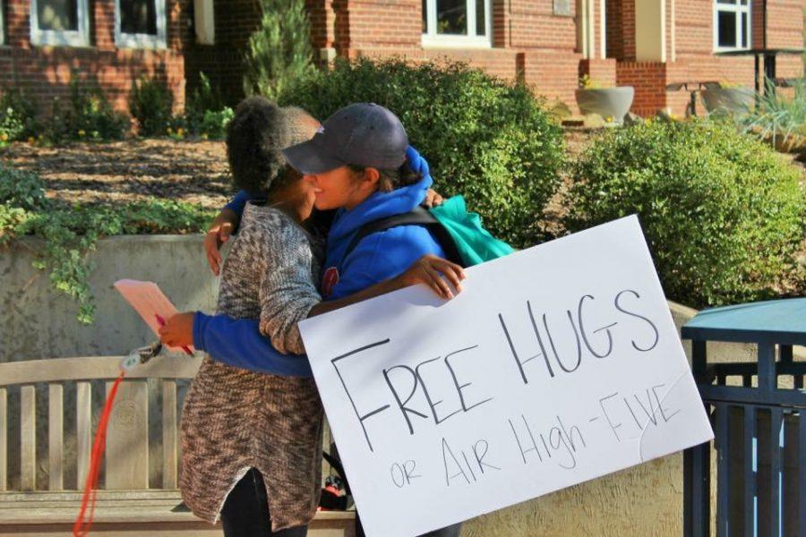 Student Jewel Zukoski embraces faculty member Michelle Hornbeak outside the Fine Arts building during the Free Hugs event.