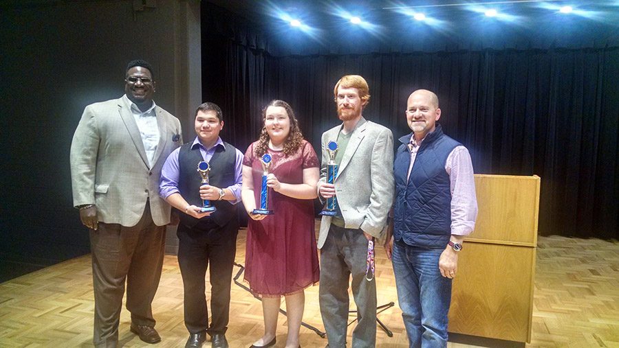 Dr. Randy Clark and Dr. Shannon stand with Public Speaking Showcase winners, Thomas Olive, Jessica Robison and James Sutton.
