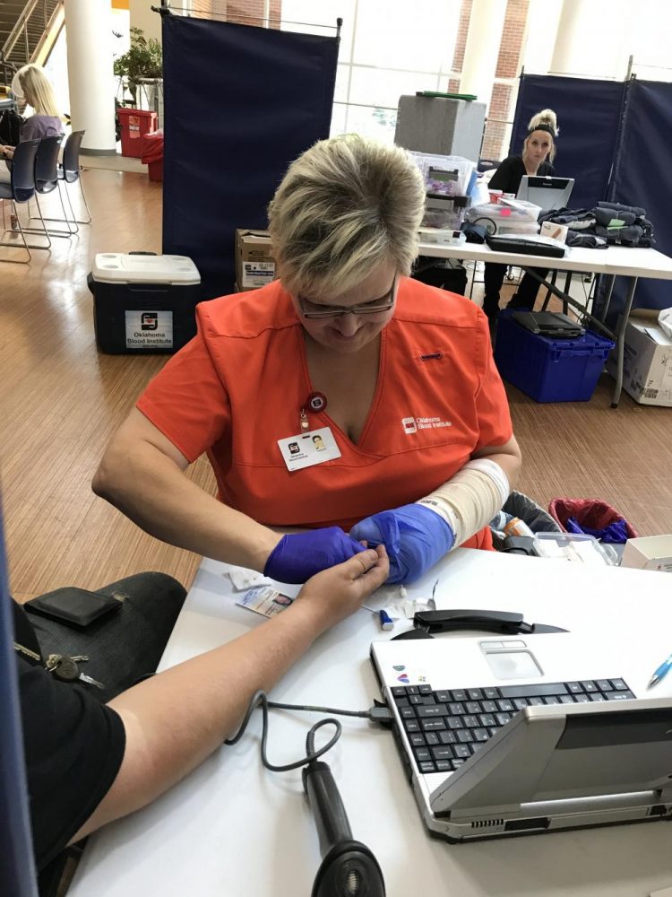 Oklahoma Blood Institute nurse prepares for an IV removal. Students lined up to give blood in hopes to help Hurricane Harvey victims. 