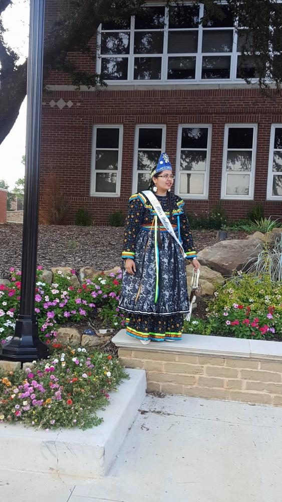 Miss Indian SOSU Faithlyn Seawright, Sophomore Studio Arts major, stands outside the Russell Building on campus.
