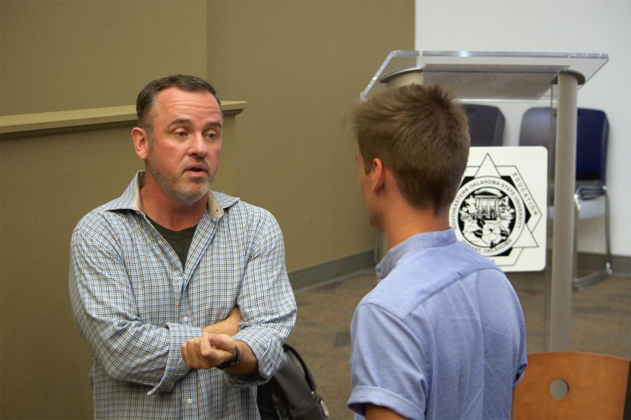 Filmmaker, Tim Rundel, speaks with Southeastern student, Spencer Patton, after presenting his latest award-winning film, Brother Valentine. Rundel took time after his presentation to speak individually with students and hand out his DVD.
