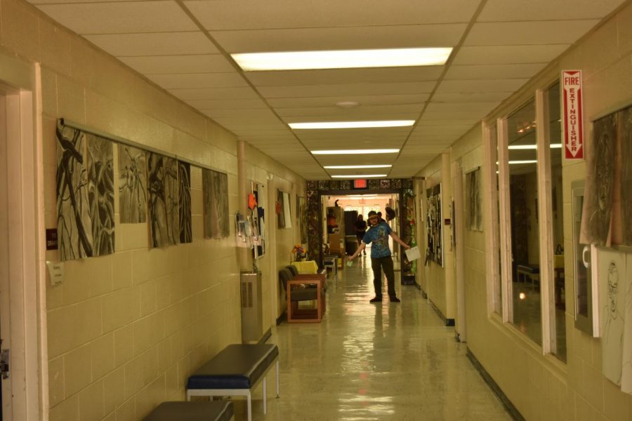 Student artwork hangs on the walls of the hallway in the Visual Arts Building on campus. 