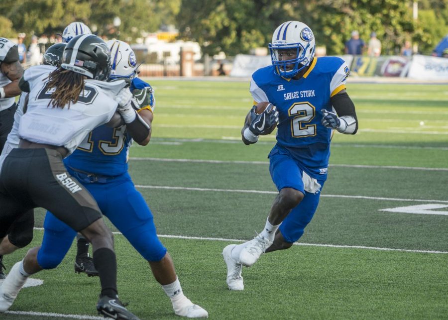 Southeastern wide receiver, Drake White, attempts to avoid Oklahoma Baptists defense during the football teams home opener. The team currently has a 5-0 record.