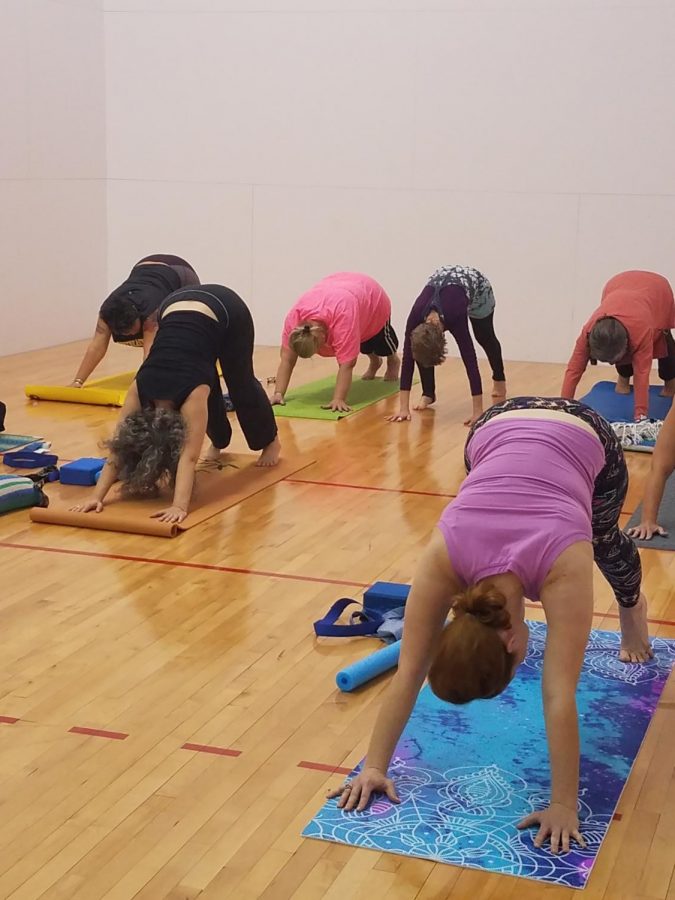 Students and staff join Dr. Walker in her yoga class, offered on MWF mornings at the Student Union.