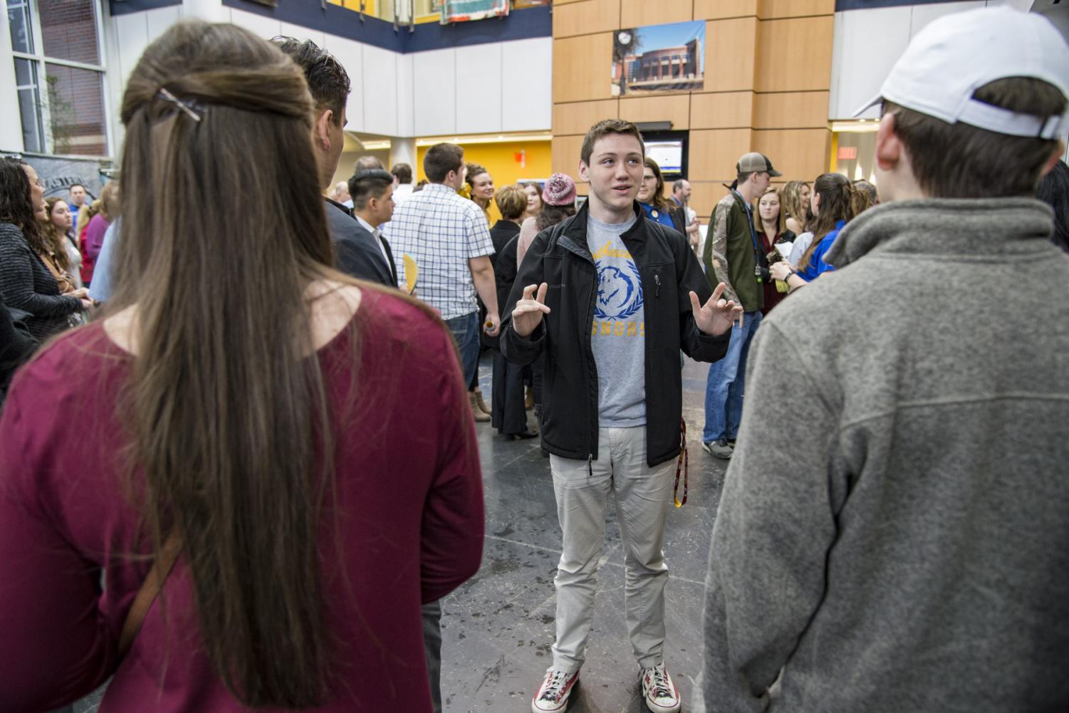 Sophomore honor's student, Nate Hodson talks with prospective students during Super Saturday on Feb. 24.