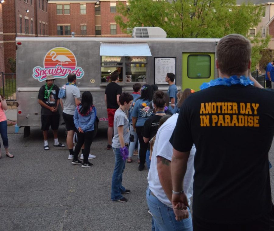 Students line up at the Snowbyrds snowcone truck on day one of Springfest.