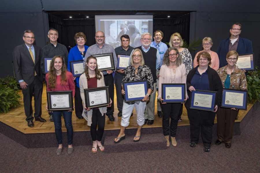 Among the award winners Monday were, front row, left to right,  Rachel Toews, Jennifer Moore, Dr. Kay Daigle, Dr. Meg Cotter-Lynch, Dr. Teresa Golden, and Dr. Laura Atchley. Back row, president Sean Burrage, Dr. Doug Wood, Cherrie Wilmoth, Dr. Tim Boatmun, Dr. Stewart Mayers, Faculty Senate chair Dr. Daniel Althoff, Brandon Burnette, Kay Barber, Dr. Loide Wasmund, and Dr. Joshua Nannestad. 
