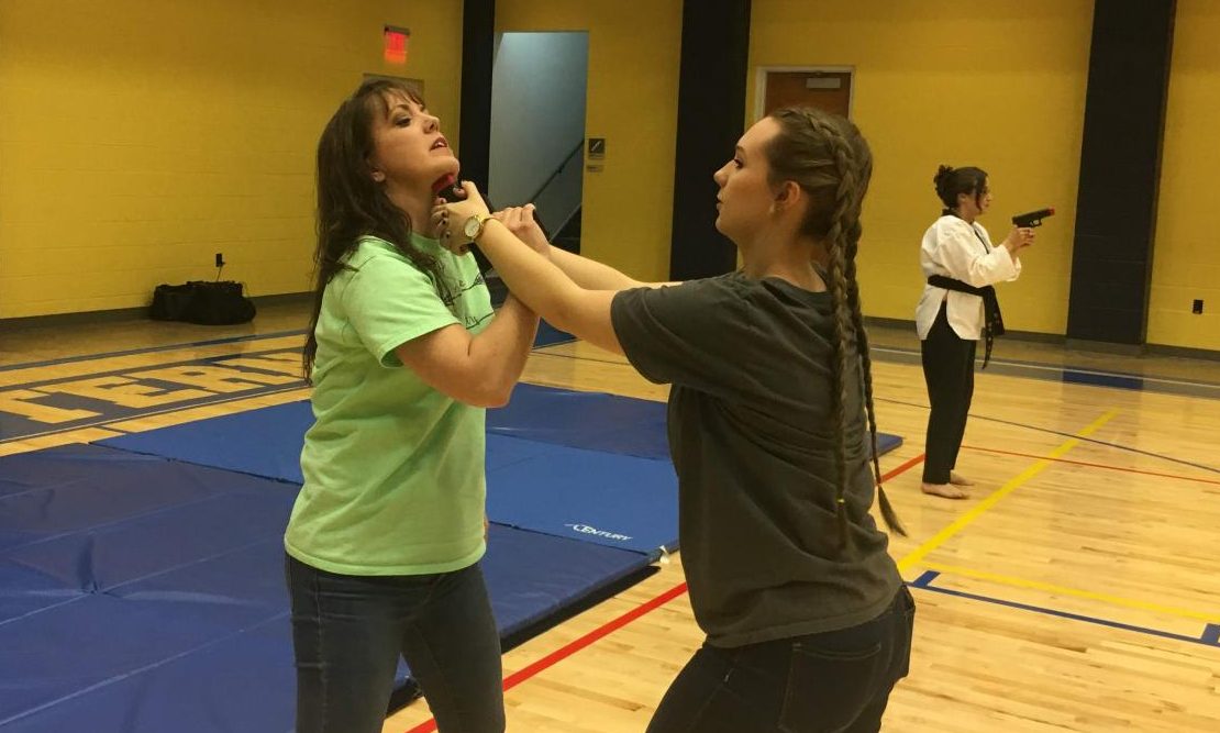 Participants watched demonstrations on self defense techniques, then were asked to practice with partners.