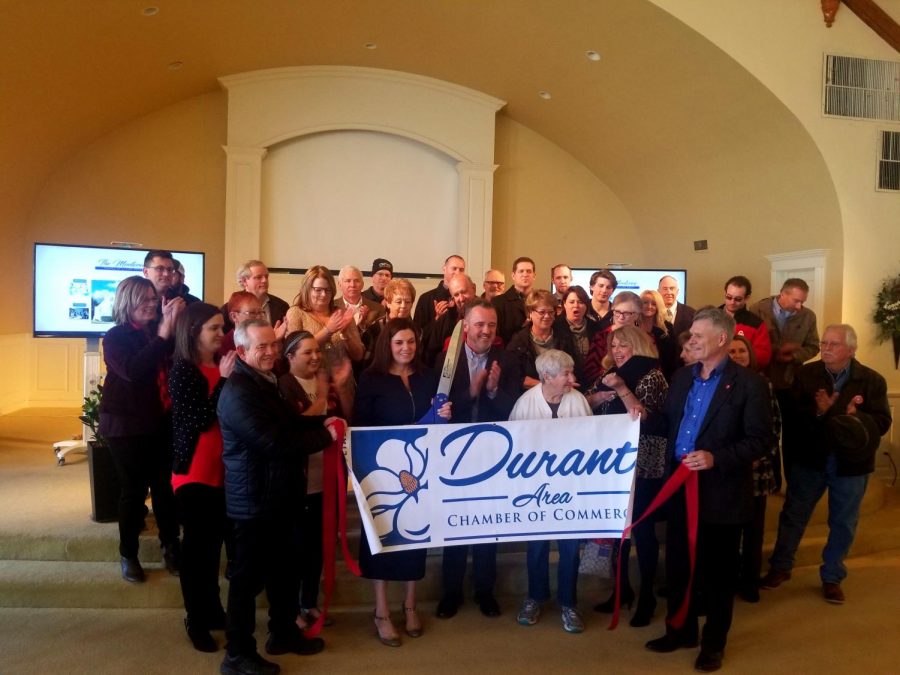 Tim and Brandy Rundel, owners of The Montery, and community members attend ribbon cutting ceremony on Feb. 7. 