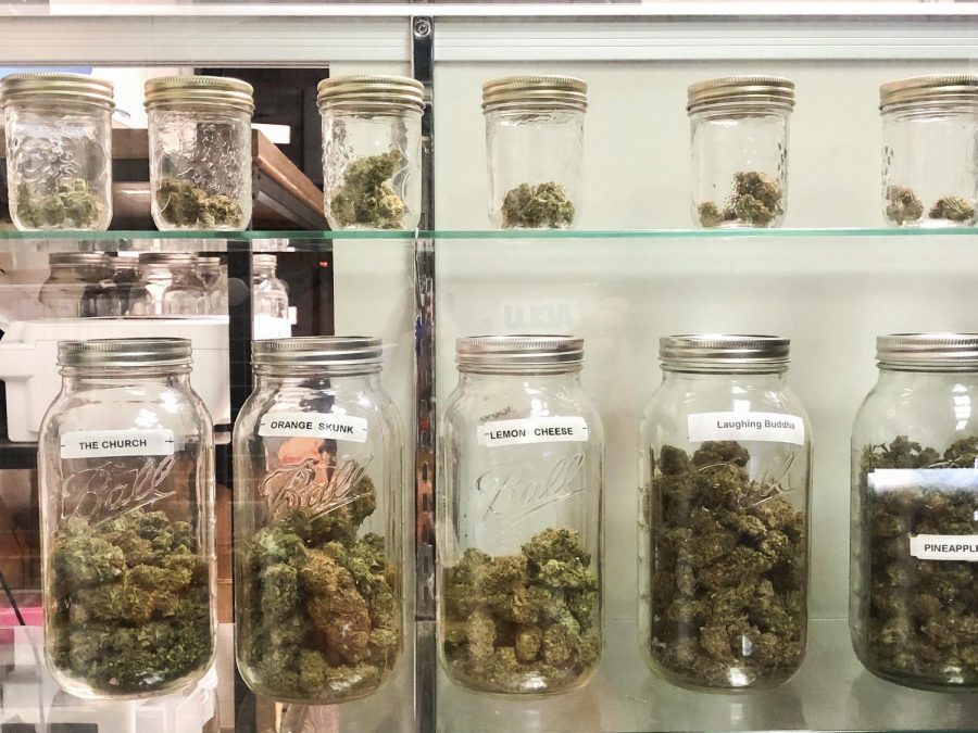 These marijuana buds are located in The Remedy in Durant. Dispensaries showcase their marijuana buds, or "flowers," in clear jars and cases so customers can view the product before purchasing.