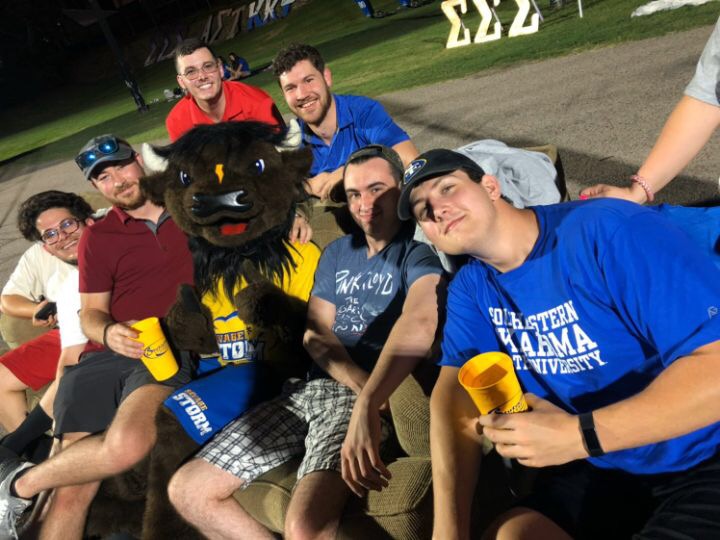 At the first football game of the season, on Thursday, September 5, members of Tau Kappa Epsilon fraternity and other students showed their school spirit by participating in a long-standing tradition of greek couches at the North end zone.  From left to right, Hunter Easely, Ezra Shelton, Jackson Self, Michael Short, Bolt, Marshal Cornelson, Aaron Lowenberg. 

