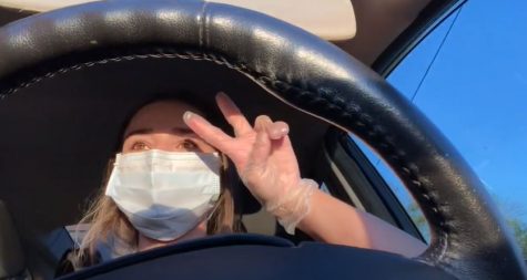 Charity Whitson throws up a peace sign as she asks viewers,