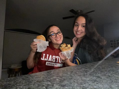 Mariah Fagan and Morgan Rosamond pose for a self-timer photo while enjoying their midnight snack of donuts from Dandy's.