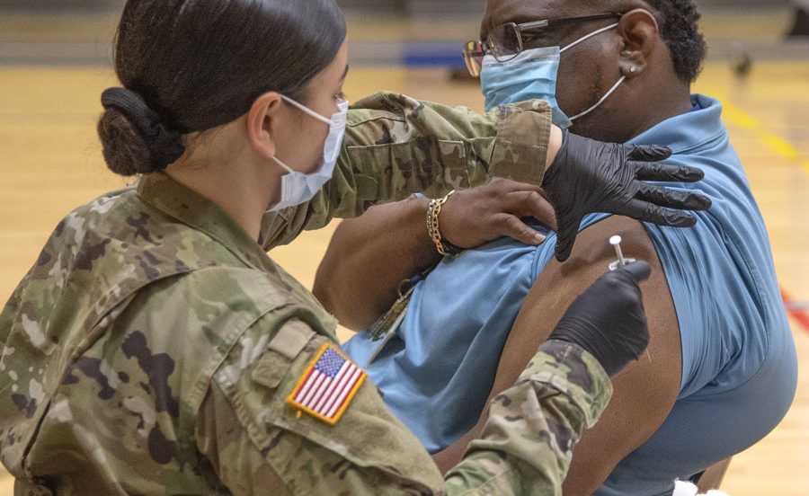 The Oklahoma National Guard assisted in the administering of vaccinations during each on-campus event. Dr. Fendrich R. Clark, Associate Professor and Speech and Debate Advisor for Southeastern, can be seen seconds before his own vaccination.